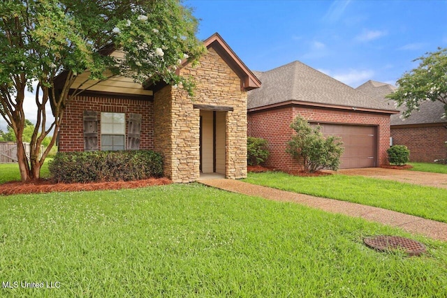 409 Sand Stone Pl, Brandon, MS 39042 - view of front of house featuring a garage, a front lawn, driveway, stone siding, and brick siding