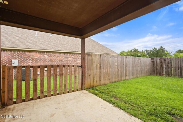 409 Sand Stone Pl, Brandon, MS 39042 - fenced backyard with a patio area