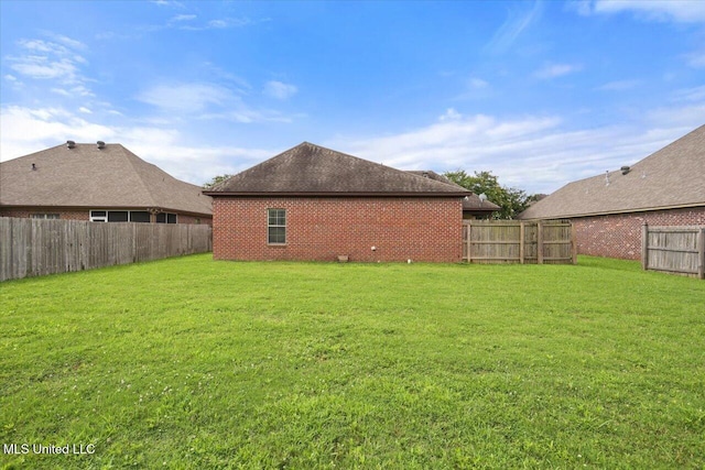 409 Sand Stone Pl, Brandon, MS 39042 - rear view of property with brick siding and a fenced backyard