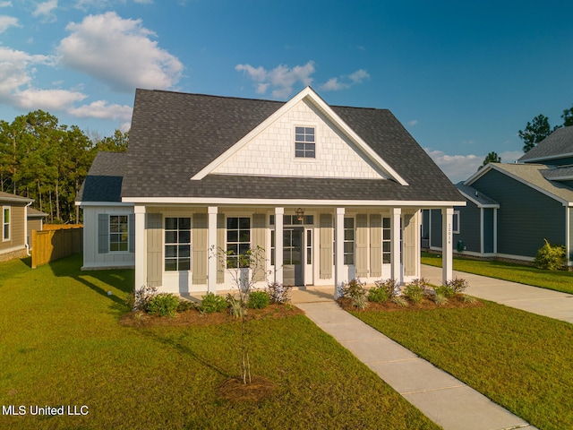 view of front of house with a front lawn and a porch