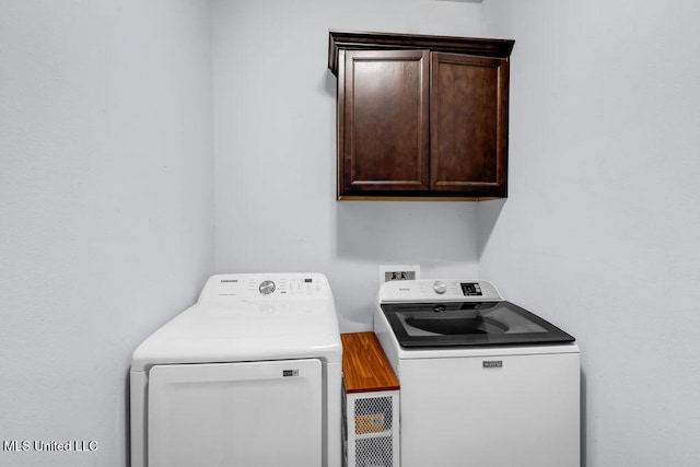 16904 Desmare St, Gulfport, MS 39503 - laundry area featuring washing machine and clothes dryer and cabinet space