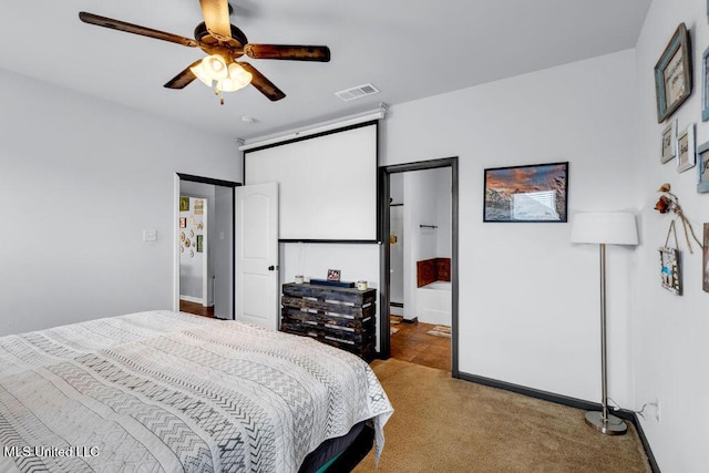 16904 Desmare St, Gulfport, MS 39503 - carpeted bedroom with baseboards and ceiling fan