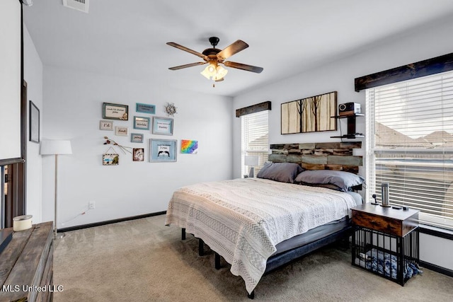 16904 Desmare St, Gulfport, MS 39503 - carpeted bedroom with baseboards and a ceiling fan