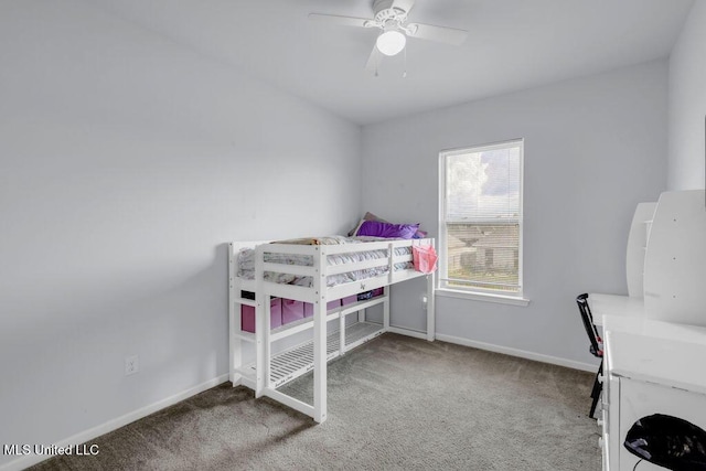 16904 Desmare St, Gulfport, MS 39503 - carpeted bedroom with baseboards and a ceiling fan