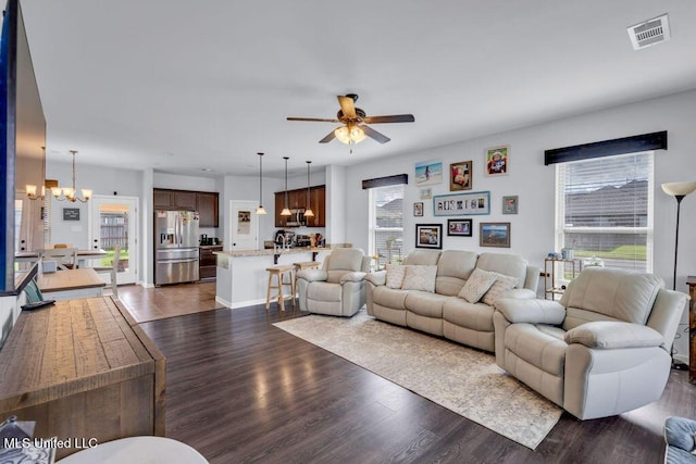 16904 Desmare St, Gulfport, MS 39503 - living area featuring a chandelier, ceiling fan, healthy amount of natural light, and dark wood-style floors