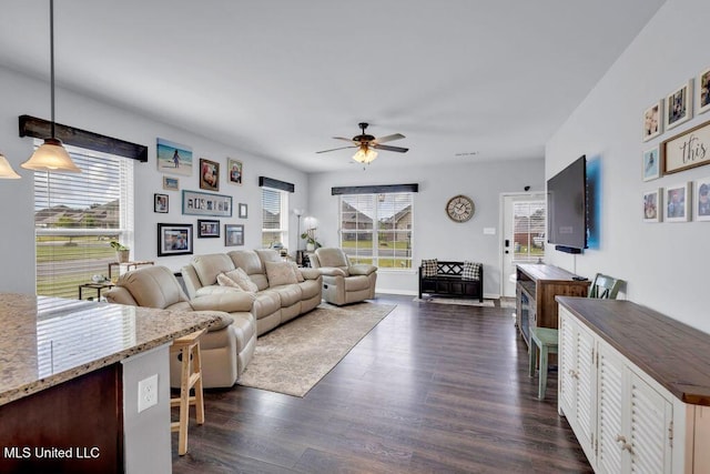 16904 Desmare St, Gulfport, MS 39503 - living room featuring plenty of natural light, ceiling fan, and dark wood-style floors