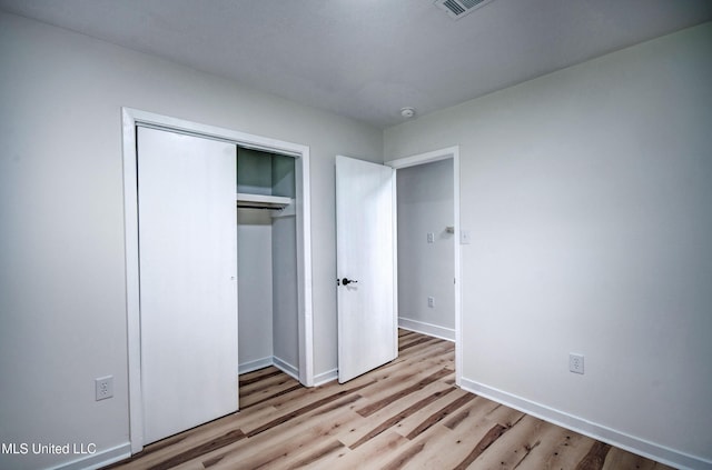 311 Danbar St, Brandon, MS 39042 - unfurnished bedroom featuring light wood-type flooring, baseboards, and a closet