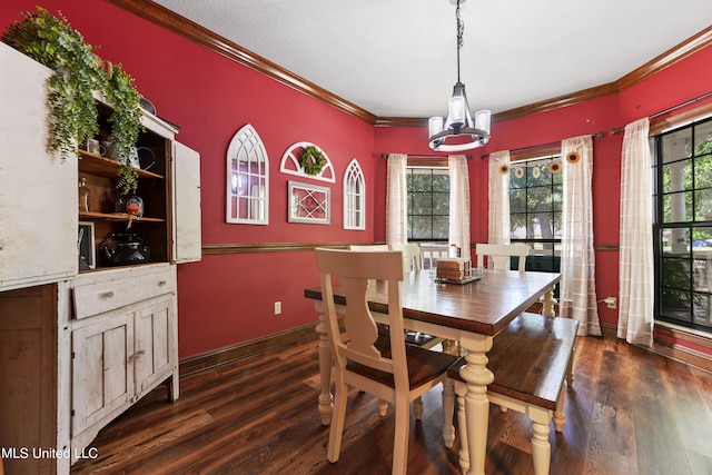 dining area with ornamental molding, a chandelier, and dark hardwood / wood-style floors