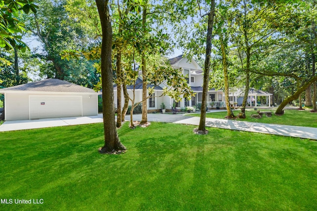 view of front of property with a front lawn and a garage