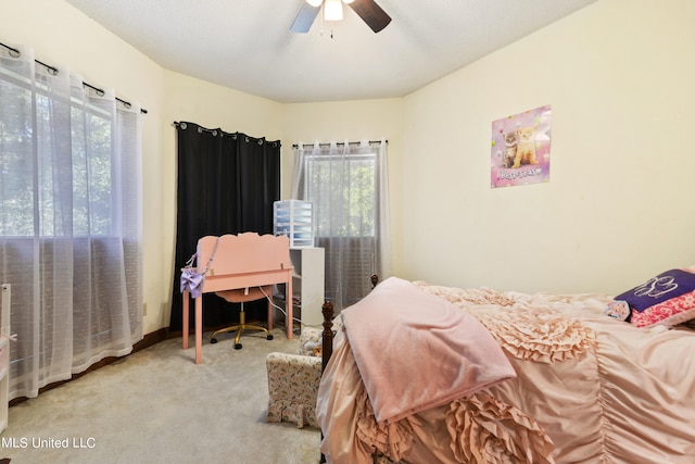 bedroom featuring multiple windows, carpet flooring, and ceiling fan