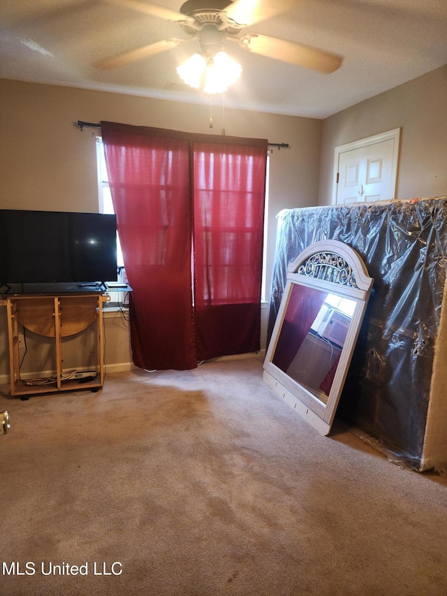 7295 Madelyn Cv, Horn Lake, MS 38637 - unfurnished living room featuring a ceiling fan, carpet, and plenty of natural light