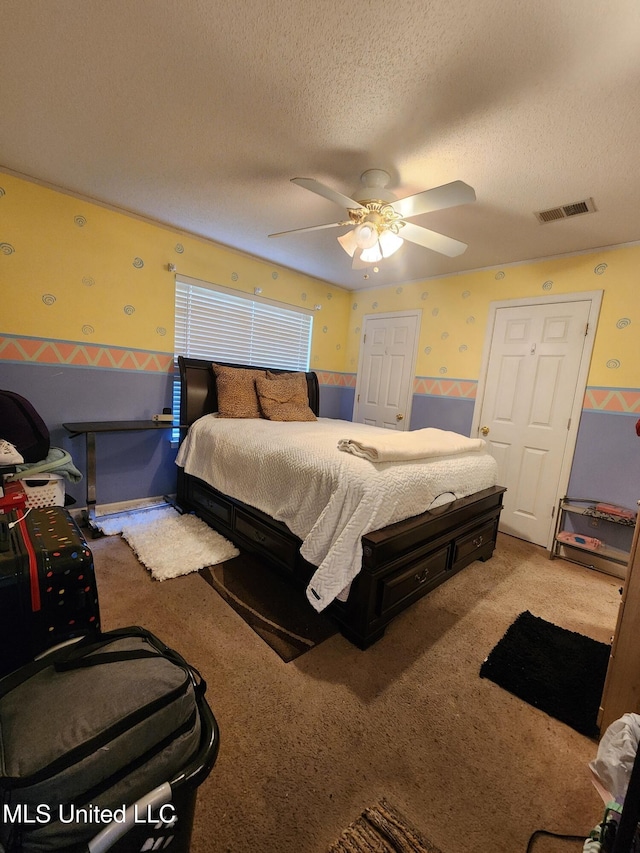 7295 Madelyn Cv, Horn Lake, MS 38637 - carpeted bedroom with wallpapered walls, wainscoting, a textured ceiling, and ceiling fan