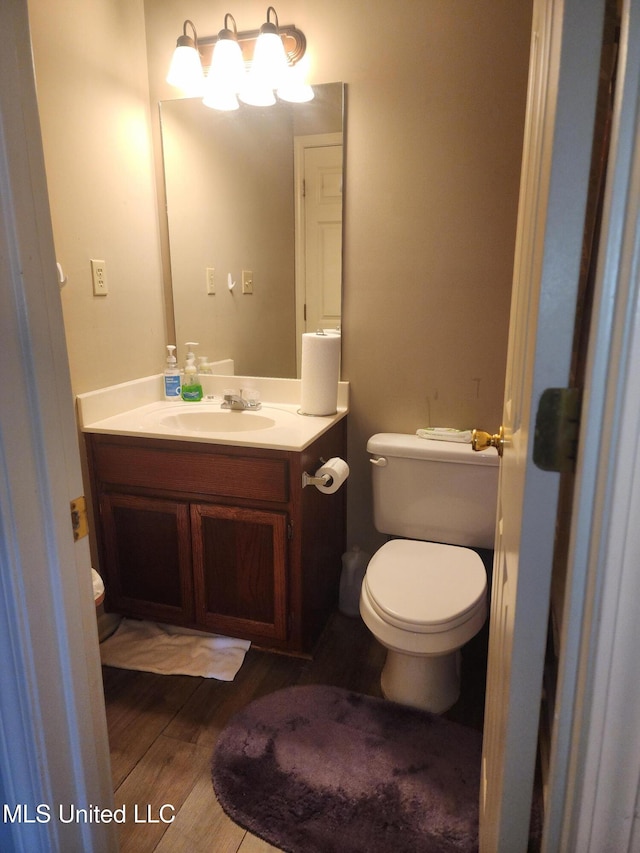 7295 Madelyn Cv, Horn Lake, MS 38637 - half bath with vanity and wood finished floors
