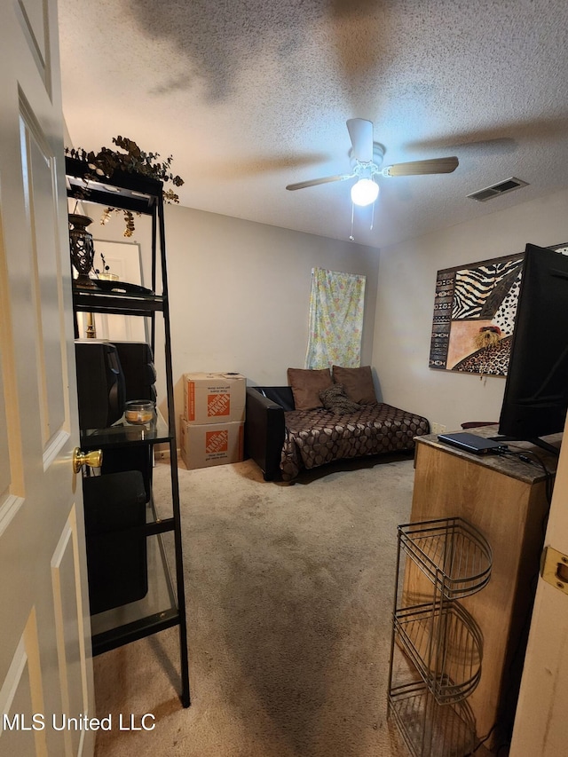 7295 Madelyn Cv, Horn Lake, MS 38637 - bedroom with carpet flooring, a textured ceiling, and a ceiling fan