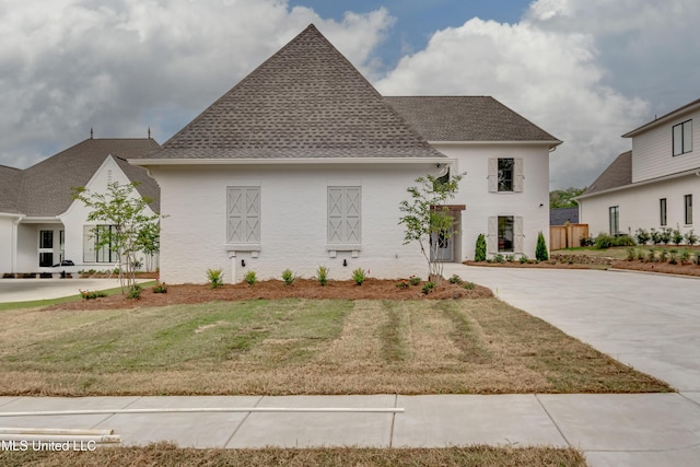 425 Whittington Cir, Madison, MS 39110 - french country style house with a front lawn and a shingled roof