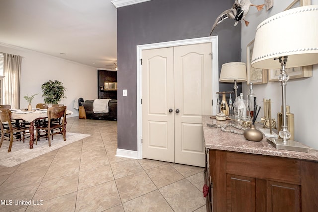 3927 Acadian Village Dr, Ocean Springs, MS 39564 - kitchen with light tile patterned floors, ceiling fan, and ornamental molding
