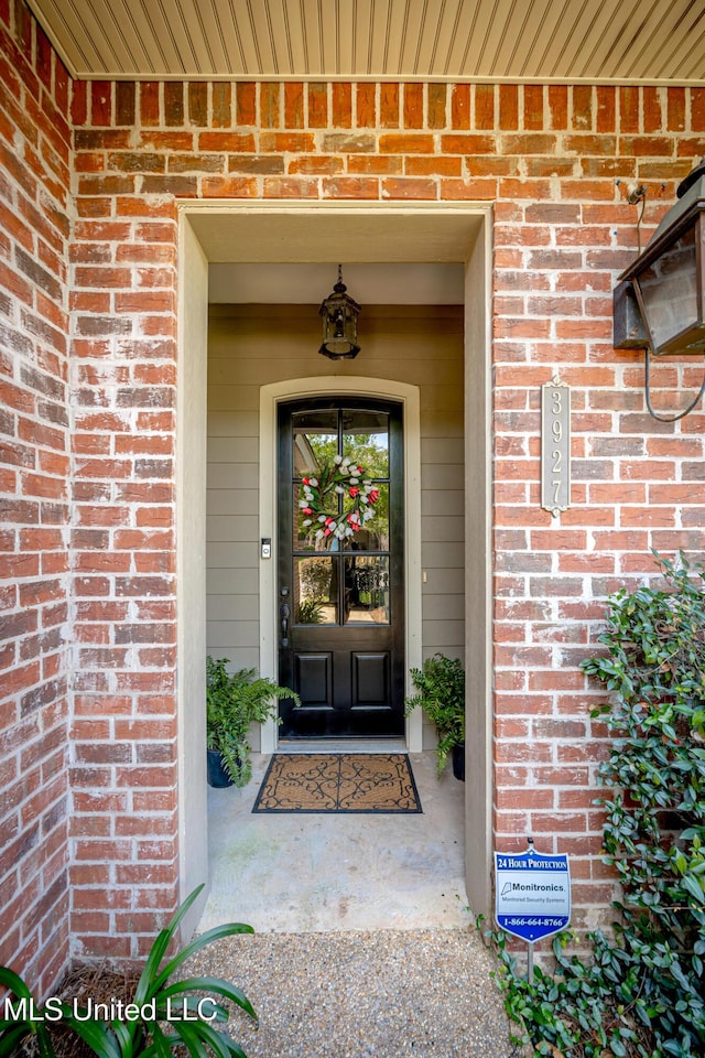3927 Acadian Village Dr, Ocean Springs, MS 39564 - view of exterior entry with brick siding