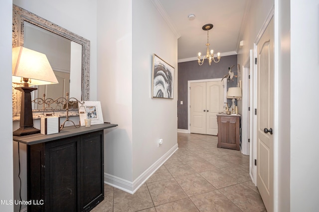 3927 Acadian Village Dr, Ocean Springs, MS 39564 - hallway featuring crown molding, a chandelier, and light tile patterned flooring