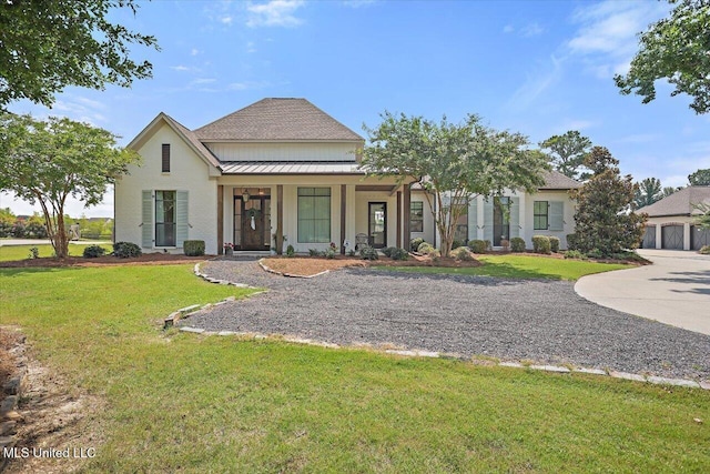 110 Crossview Pl, Brandon, MS 39047 - modern farmhouse style home featuring a standing seam roof, a front lawn, a metal roof, a porch, and roof with shingles
