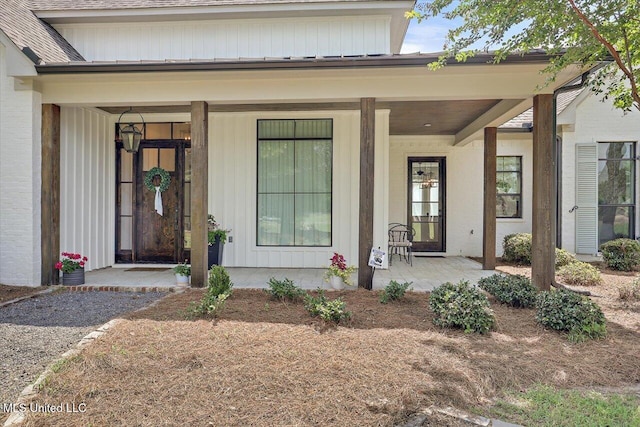 110 Crossview Pl, Brandon, MS 39047 - doorway to property with covered porch, board and batten siding, and a shingled roof