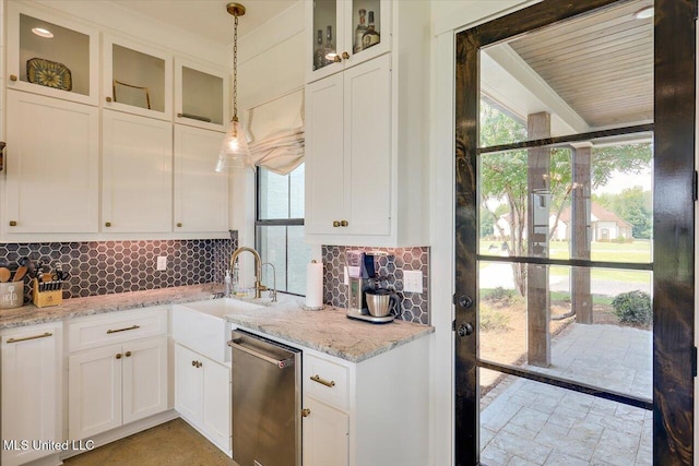 110 Crossview Pl, Brandon, MS 39047 - kitchen with stainless steel dishwasher, white cabinetry, and backsplash
