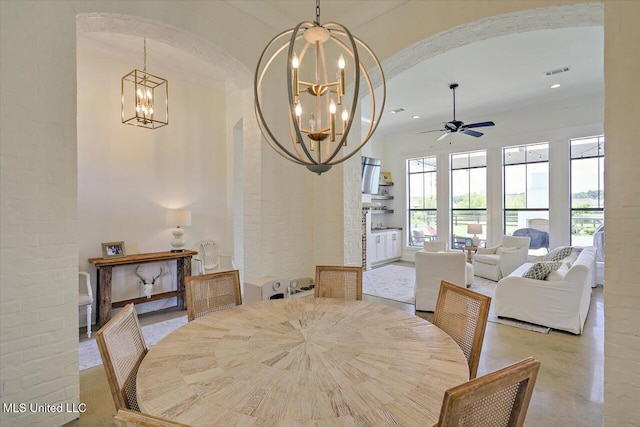 110 Crossview Pl, Brandon, MS 39047 - dining space with a chandelier, arched walkways, a ceiling fan, and recessed lighting