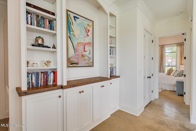 110 Crossview Pl, Brandon, MS 39047 - corridor with built in shelves and concrete flooring