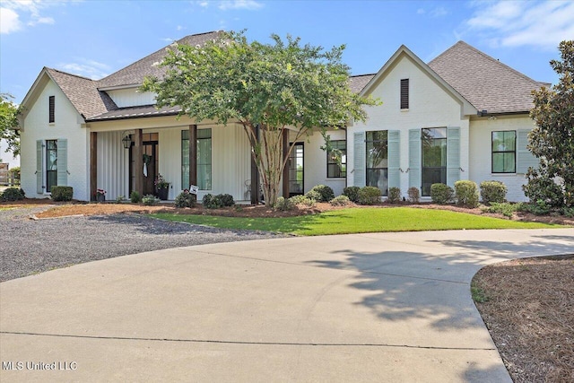 110 Crossview Pl, Brandon, MS 39047 - view of front of home with roof with shingles, a porch, board and batten siding, and brick siding