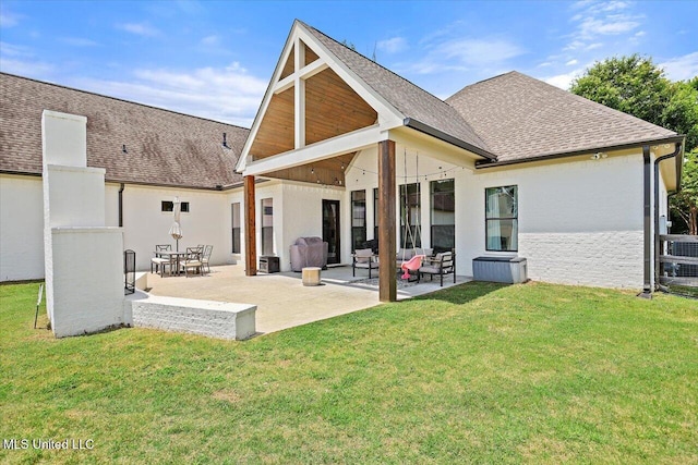 110 Crossview Pl, Brandon, MS 39047 - back of house with roof with shingles, a patio area, and a lawn