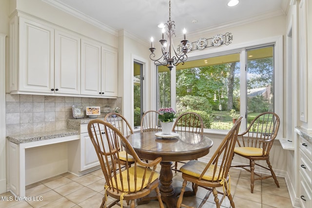 29 Avery Cir, Jackson, MS 39211 - dining area featuring light tile patterned floors, a chandelier, crown molding, built in desk, and recessed lighting