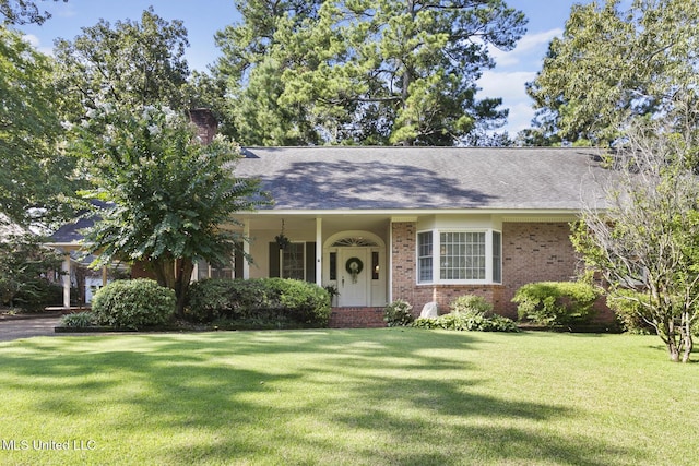29 Avery Cir, Jackson, MS 39211 - view of front facade with a front yard, brick siding, and a chimney