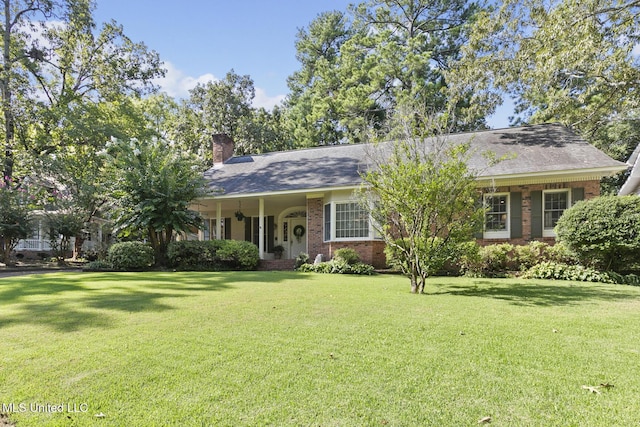 29 Avery Cir, Jackson, MS 39211 - view of front of property featuring a chimney, a front yard, and brick siding