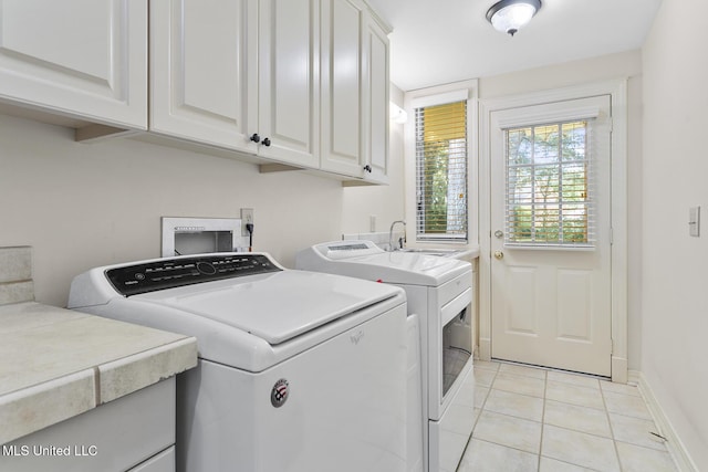 29 Avery Cir, Jackson, MS 39211 - laundry area featuring cabinet space, independent washer and dryer, and light tile patterned floors