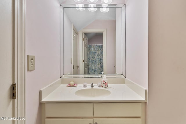 29 Avery Cir, Jackson, MS 39211 - full bathroom featuring vanity and lofted ceiling
