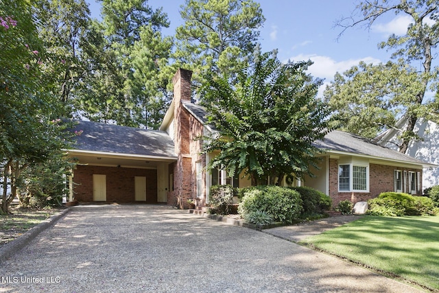 29 Avery Cir, Jackson, MS 39211 - view of front of property with brick siding, gravel driveway, and a chimney
