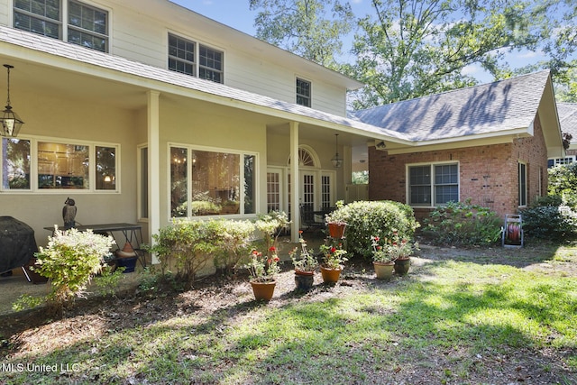 29 Avery Cir, Jackson, MS 39211 - back of house with a yard, french doors, and brick siding