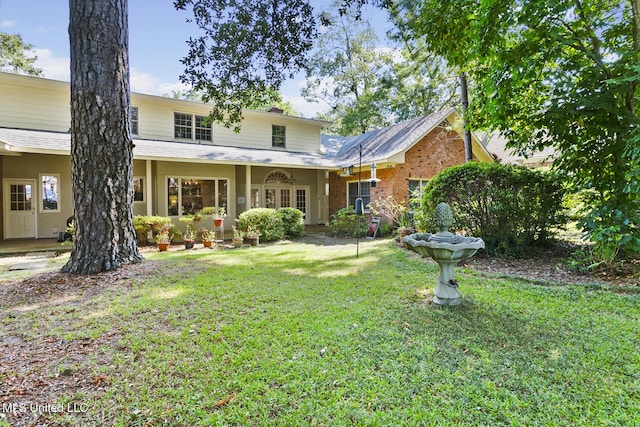 29 Avery Cir, Jackson, MS 39211 - rear view of house with a yard and brick siding