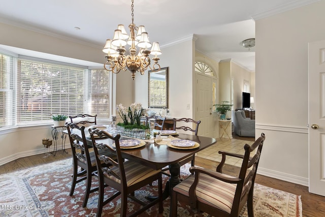 29 Avery Cir, Jackson, MS 39211 - dining area featuring a chandelier, ornamental molding, and wood finished floors