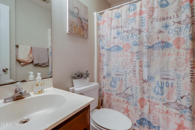 14906 Angela Dr, Gulfport, MS 39503 - bathroom with vanity, toilet, and a shower with shower curtain