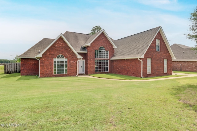 2901 Village Cir, Ocean Springs, MS 39564 - view of front of house featuring brick siding, roof with shingles, and a front yard