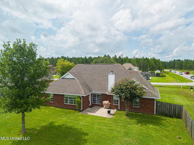 2901 Village Cir, Ocean Springs, MS 39564 - rear view of house with brick siding, a patio area, a chimney, and a fenced backyard
