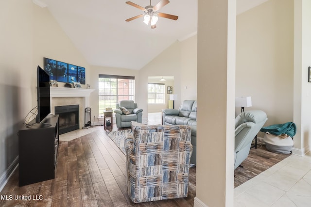 2901 Village Cir, Ocean Springs, MS 39564 - living room with a ceiling fan, high vaulted ceiling, wood finished floors, and a tile fireplace