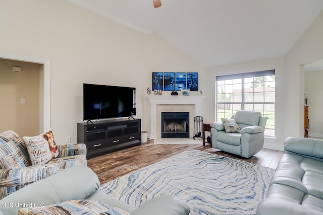 2901 Village Cir, Ocean Springs, MS 39564 - living area with lofted ceiling, wood finished floors, a tile fireplace, and a ceiling fan
