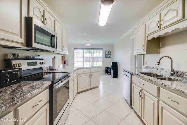 2901 Village Cir, Ocean Springs, MS 39564 - kitchen with stainless steel appliances, light stone countertops, light tile patterned flooring, a peninsula, and ornamental molding