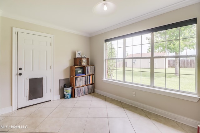 2901 Village Cir, Ocean Springs, MS 39564 - spare room with ornamental molding and light tile patterned floors