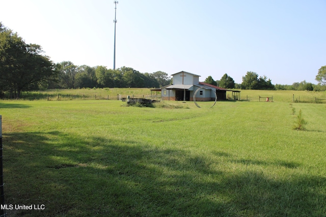 294 Yandell Rd, Canton, MS 39046 - view of green lawn featuring a rural view and an outdoor structure