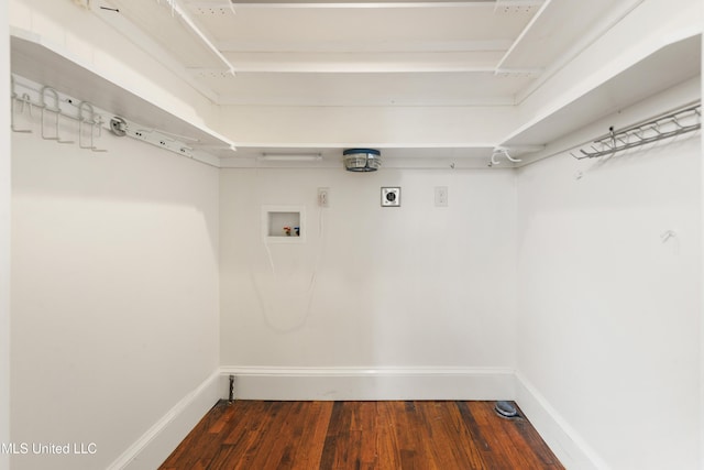 washroom with dark hardwood / wood-style flooring, hookup for a washing machine, and electric dryer hookup