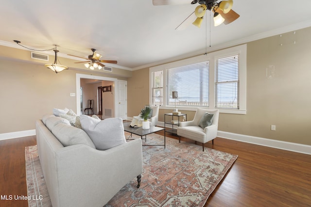 living room featuring crown molding, ceiling fan, and dark hardwood / wood-style flooring