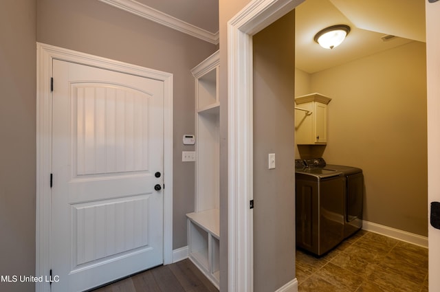 interior space with washer and clothes dryer and ornamental molding