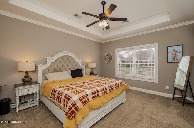 carpeted bedroom featuring a raised ceiling, crown molding, and ceiling fan